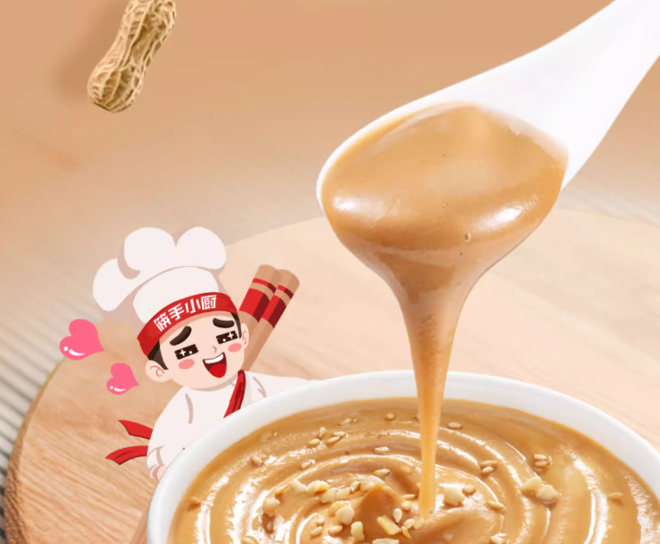 Spoonful of HAIDILAO Peanut Sesame Sauce being poured into a bowl, garnished with chopped peanuts and sesame