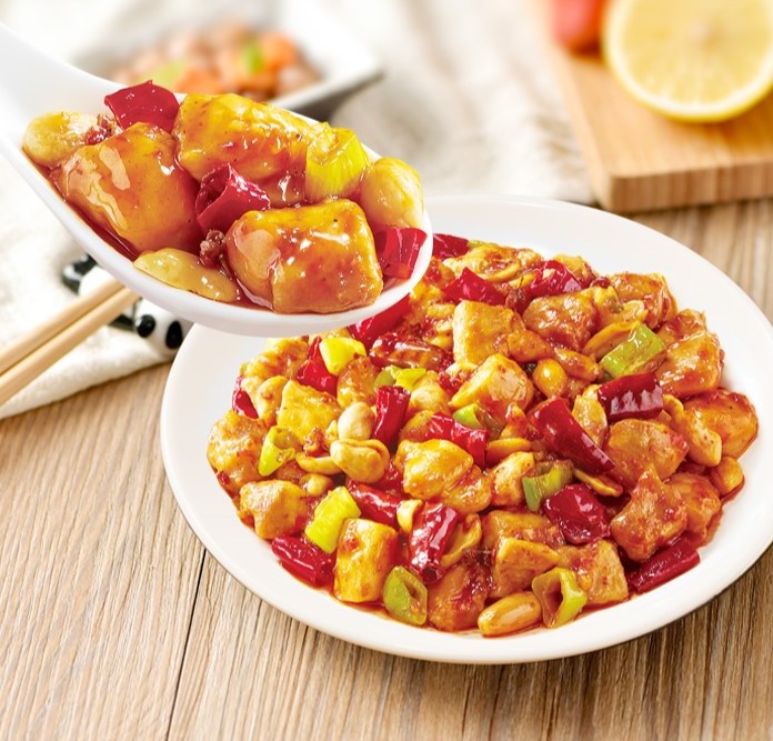 Plate of Kung Pao chicken with peanuts, dried chilies, and scallions made with HAIDILAO Kung Pao Cooking Sauce