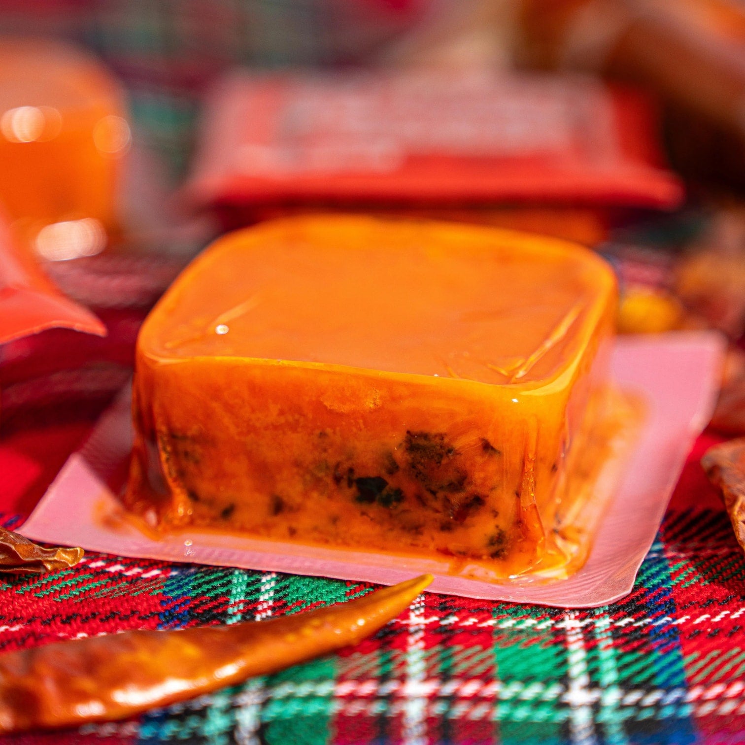 Close-up of HAIDILAO Spicy Hot Pot Soup Base block showing texture with spices