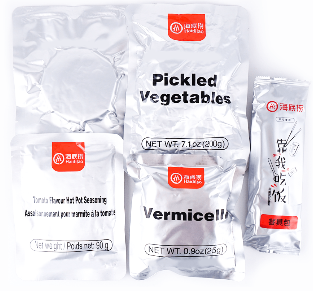 HAIDILAO Tomato Flavor Self-Heating Hot Pot contents: pickled vegetables, tomato flavor seasoning packet, vermicelli, and utensil packet