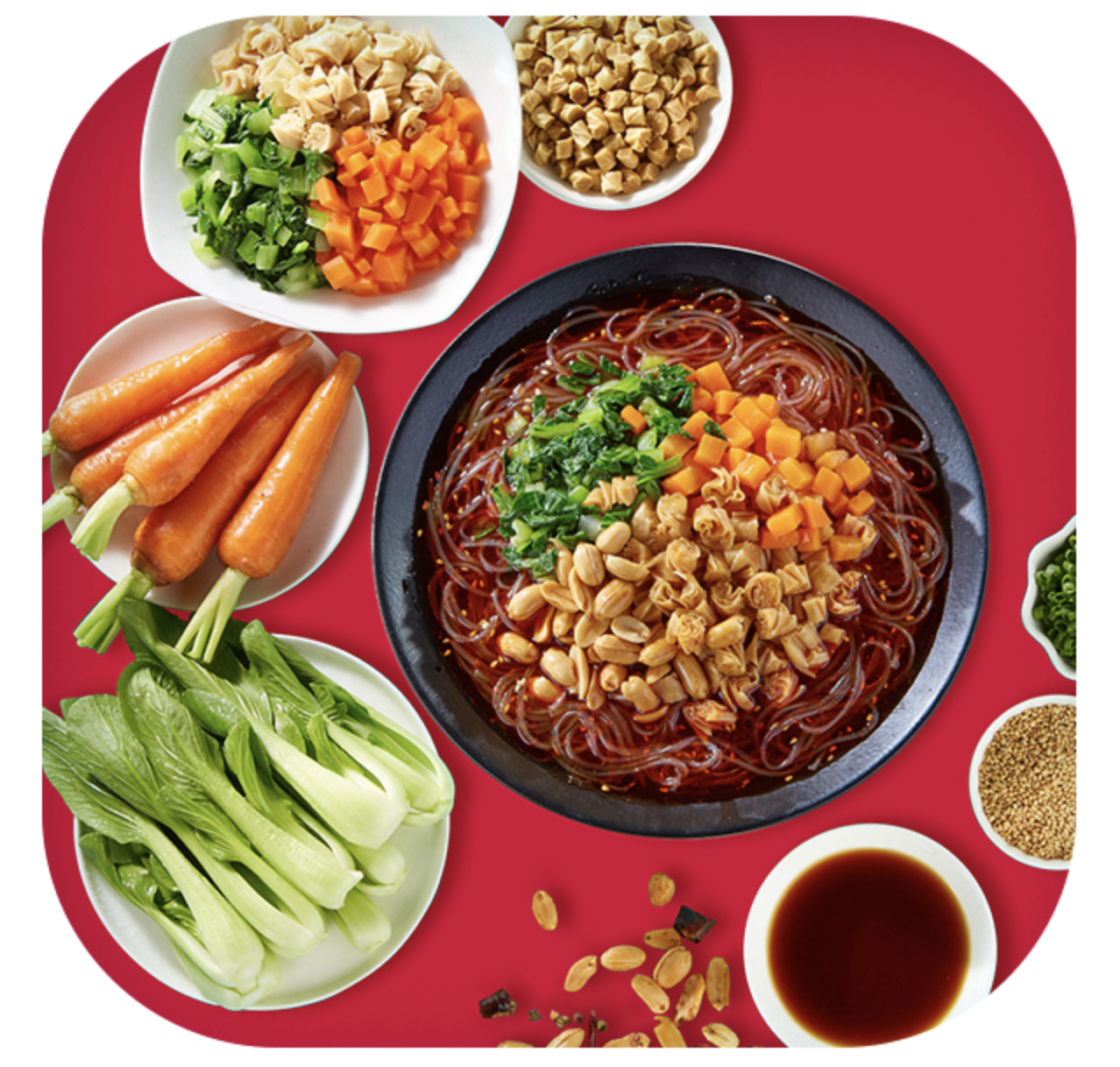 Prepared bowl of hot and sour vermicelli with pickled vegetables, carrots, peanuts, and bok choy, with raw ingredients shown alongside