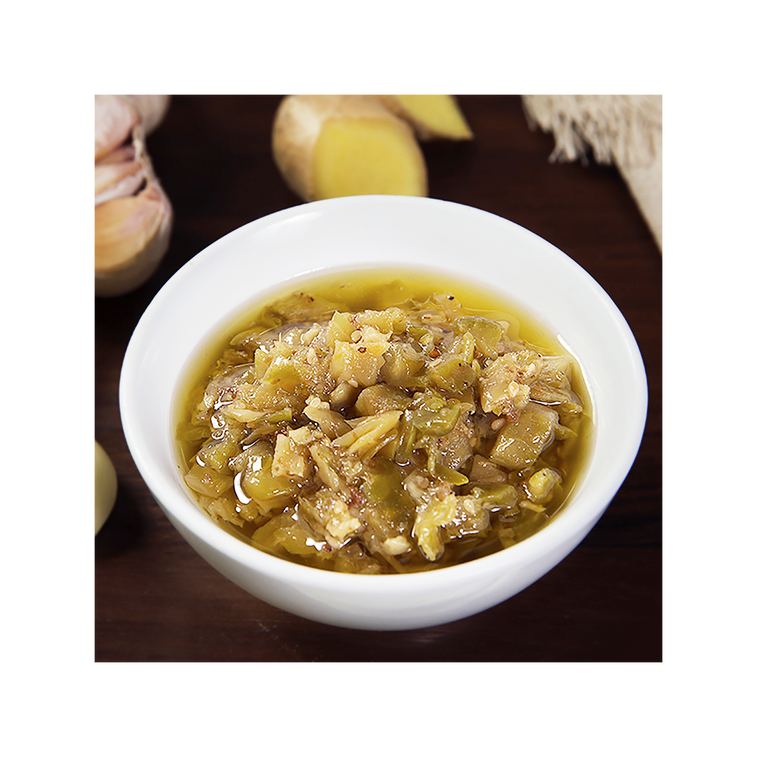 Bowl of chopped pickled mustard relish with ginger and garlic used in HAIDILAO Shrimp Hot Pot Soup Base