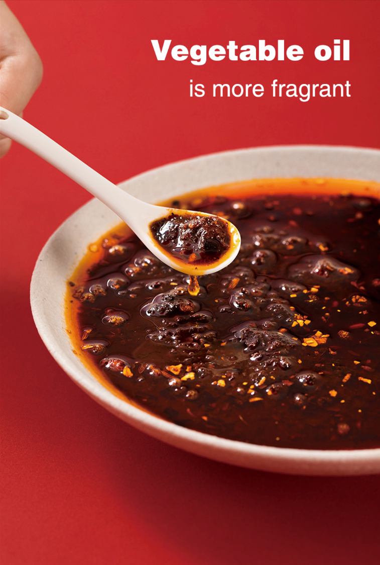 Spoonful of HAIDILAO Hot & Spicy Hot Pot Soup Base sauce, made with fragrant vegetable oil