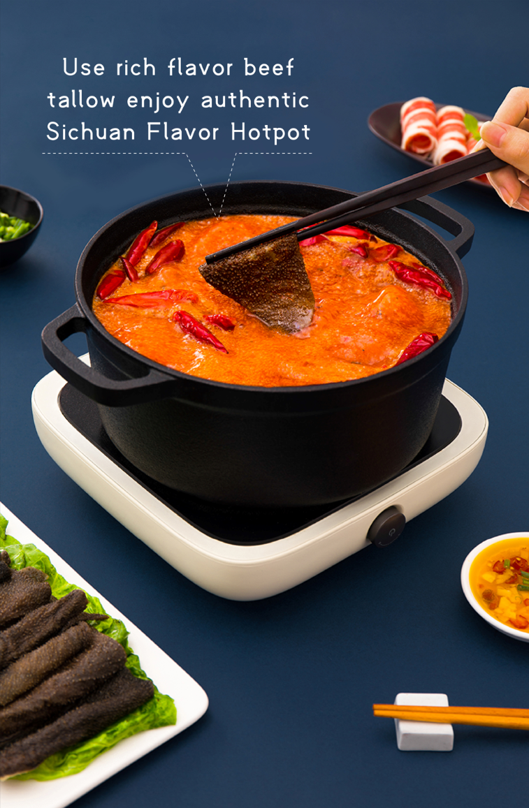 Chopsticks lifting tripe from a bubbling pot of HAIDILAO Beef Tallow Hot Pot, rich beef tallow for authentic Sichuan flavor